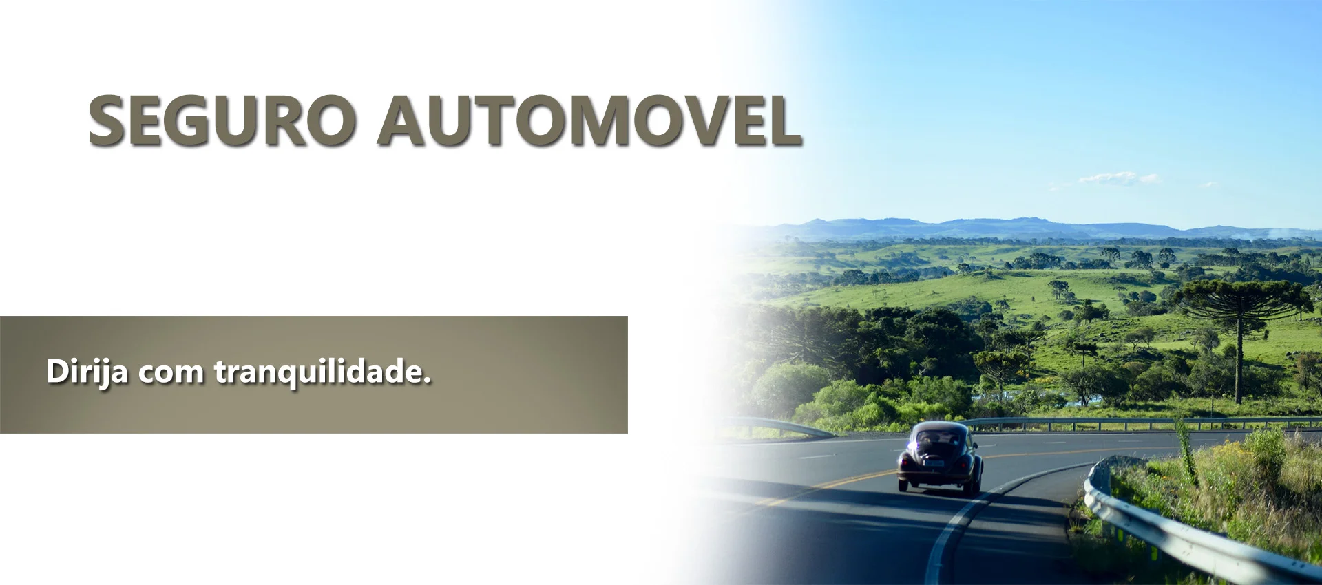 Seguro Automovel: VW Fusca andando na rodovia, com uma bela paisagem montanhosa e bem arborizada.